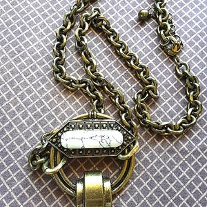 Antique looking necklace with a faux white buffalo stone.